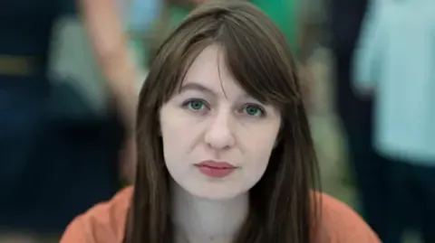 Sally Rooney claims she will not enter the UK due to potential arrest